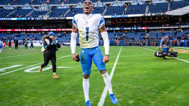 Lions cornerback Jeffrey Okudah celebrates after defeating the Bears in a game.